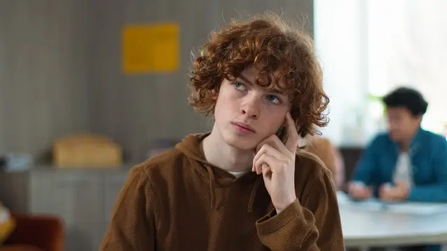 A high school student is pondering his career objective