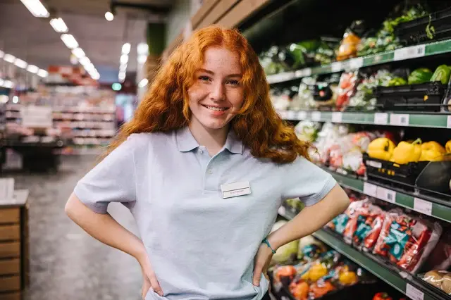 Young female worker at a grocery store.