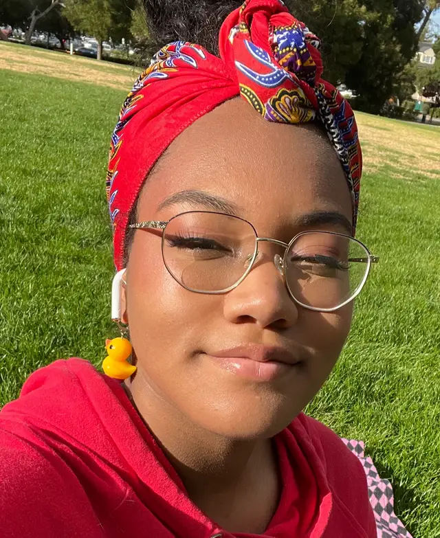 woman wearing red with a red headscarf