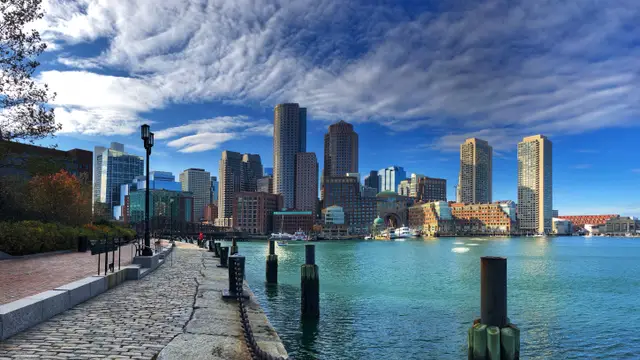 city waterfront with a walking path in the foreground