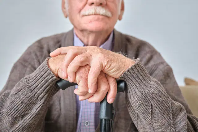 Close up of older gentleman with a cane