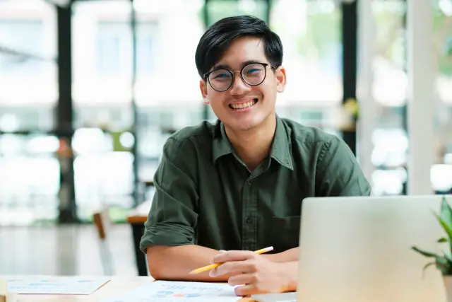 Smiling male student looking into the camera
