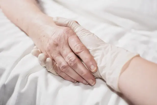 To what extent do theories of personal identity support or oppose the execution of advance euthanasia directives for patients experiencing severe cognitive impairment?