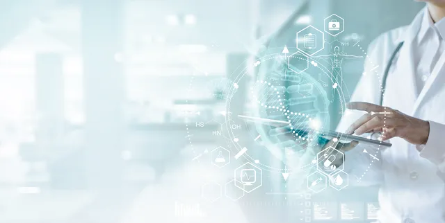 Researcher looking at data on digital tablet with infographics